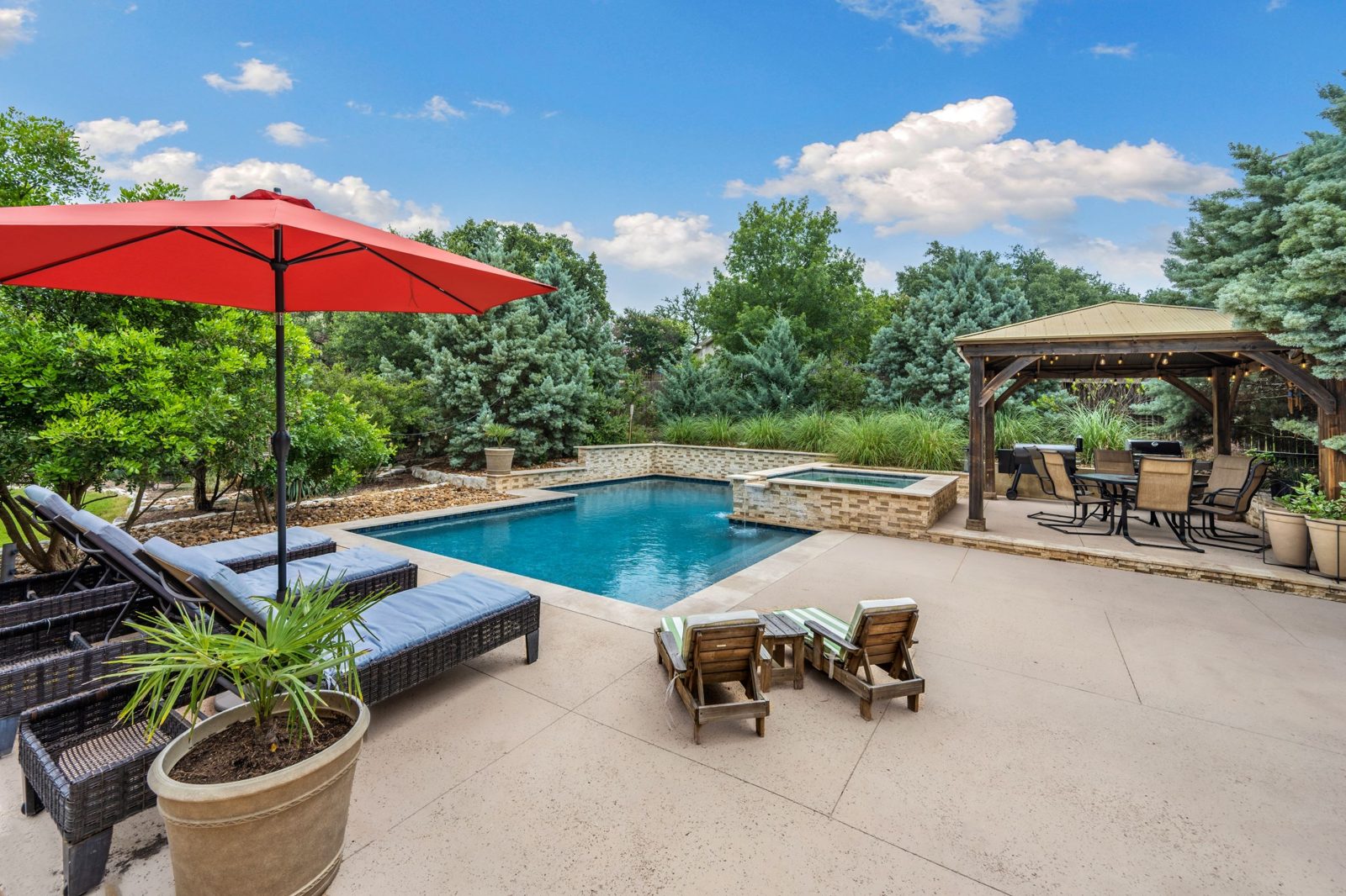 Clean backyard swimming pool in Texas sunlight